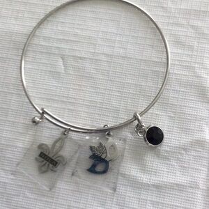 Woman’s sliver color Bracelet with 3 small charms NWOT